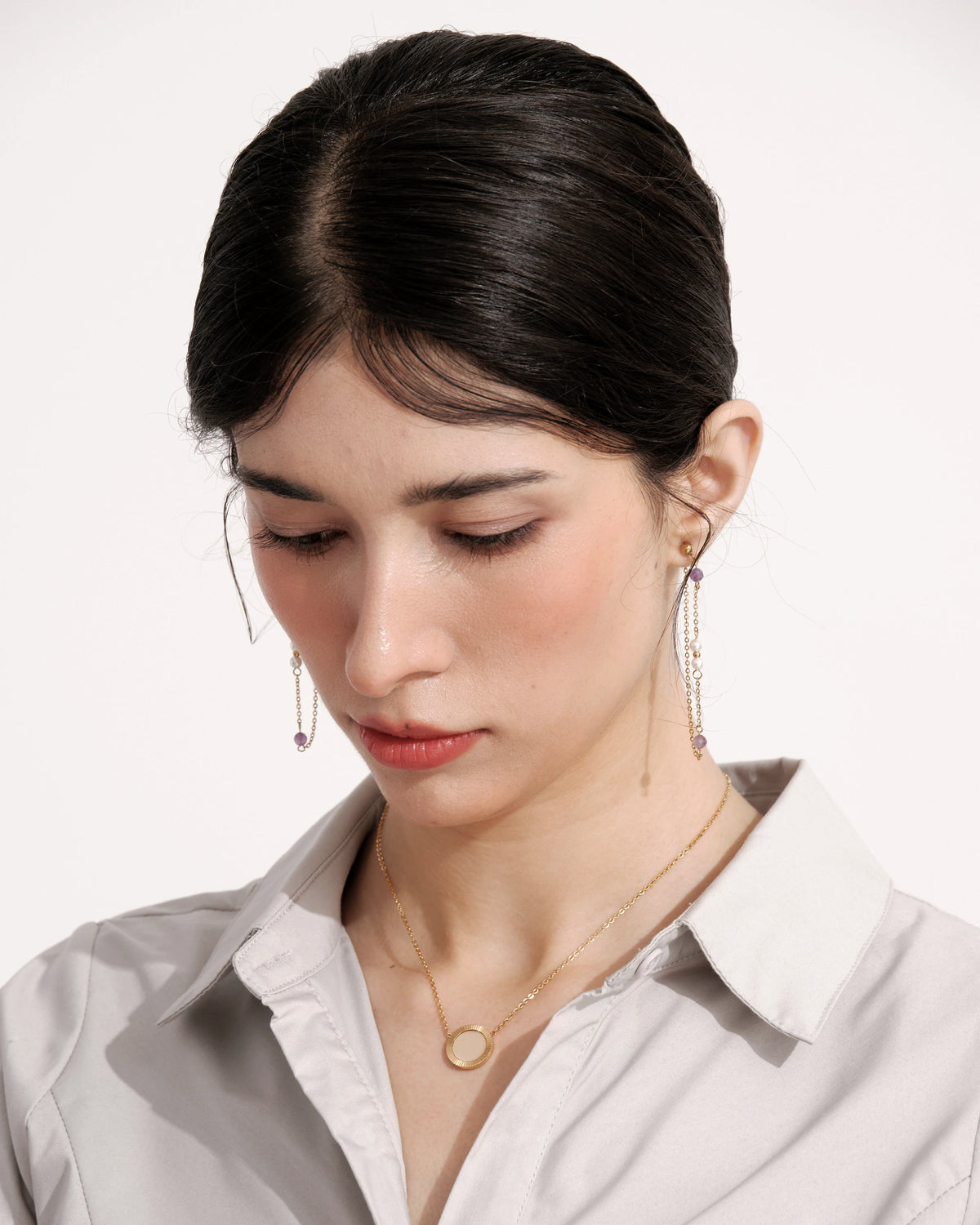 Portrait of a model wearing long Lavender Drift Drop Earrings