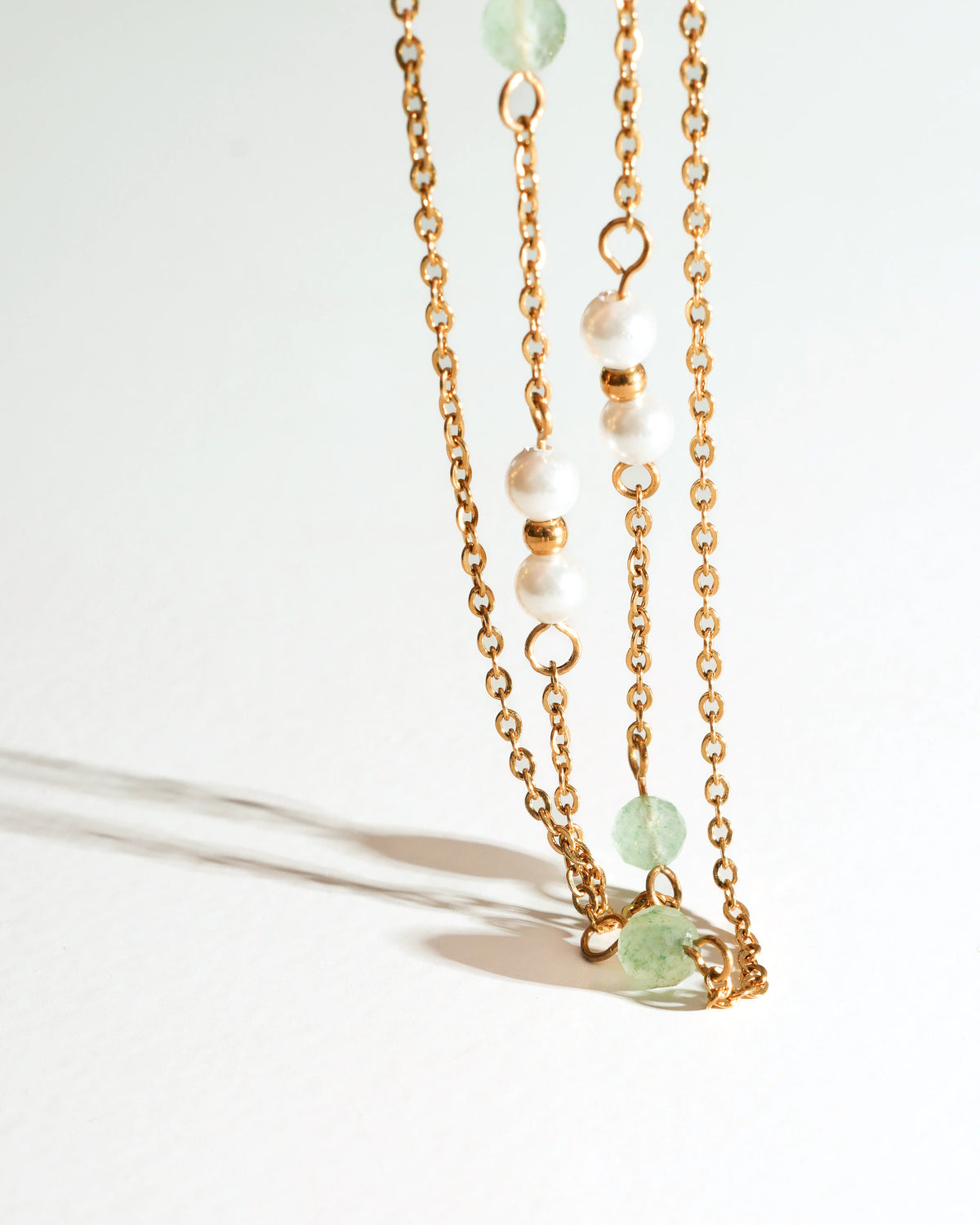 Detail view of Willow Drift Drop Earrings with long gold chains