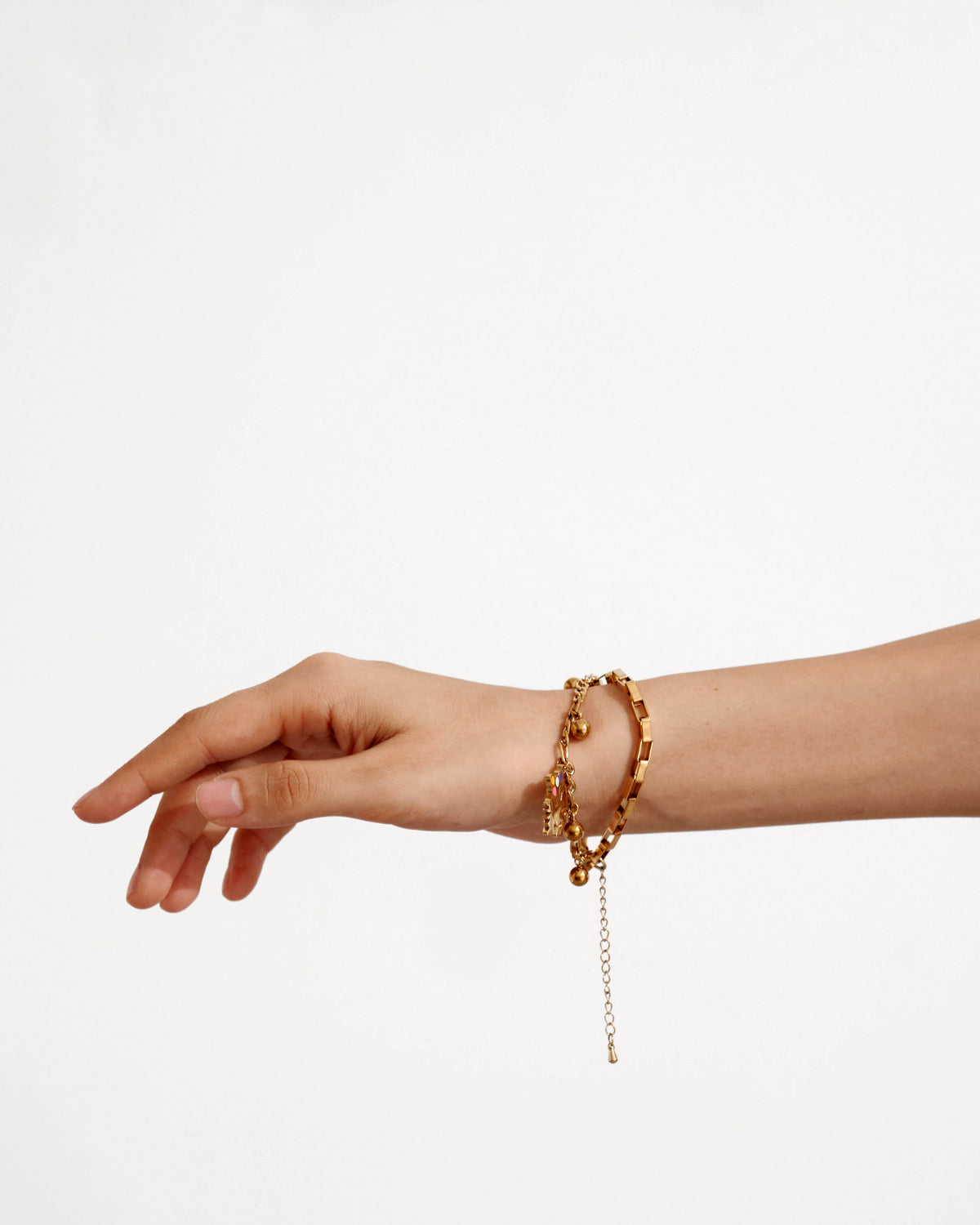 Model wearing the Guardian Talisman Bracelet with dangling figure charms