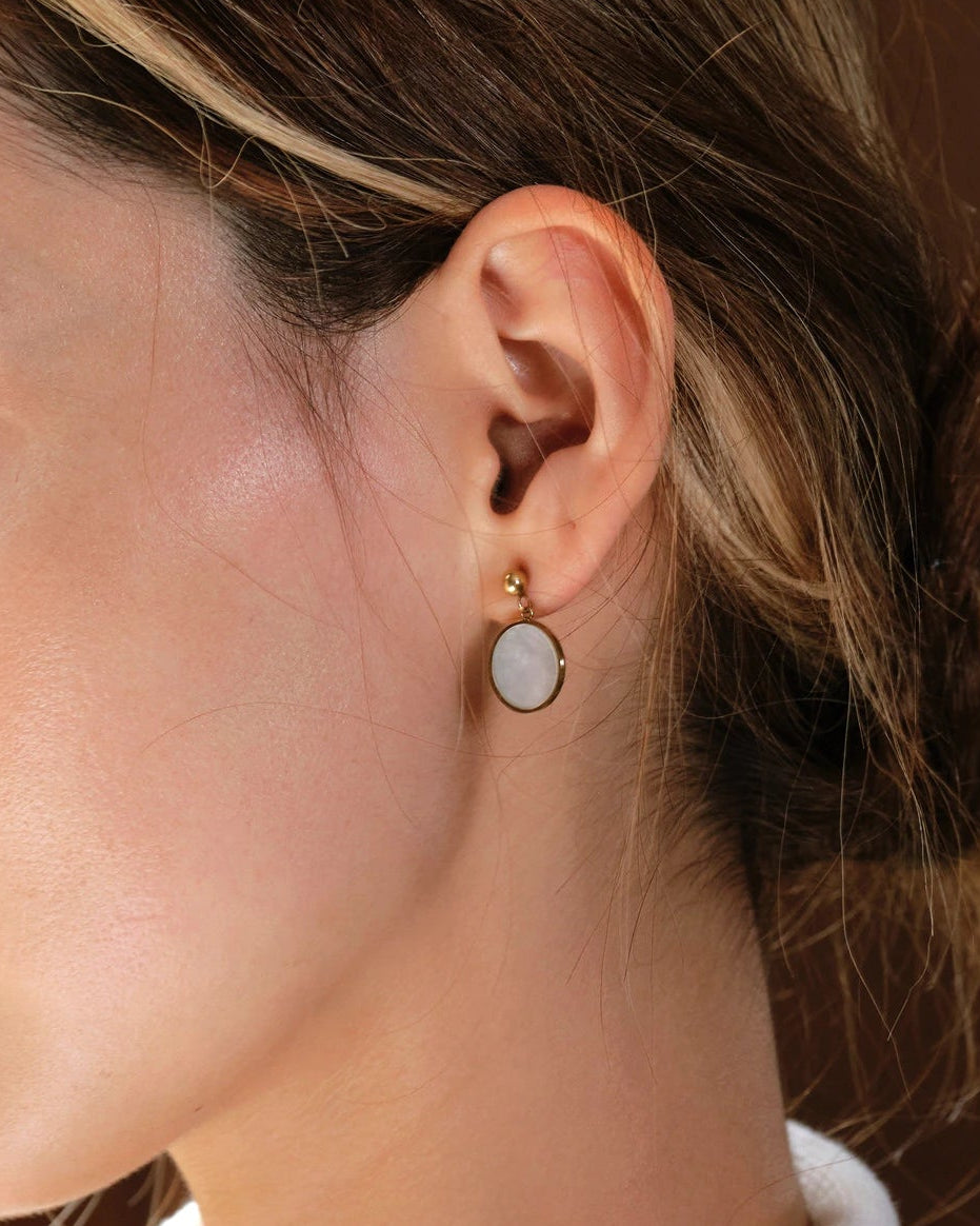 Side profile of model wearing the Tide Stone Stud Earrings