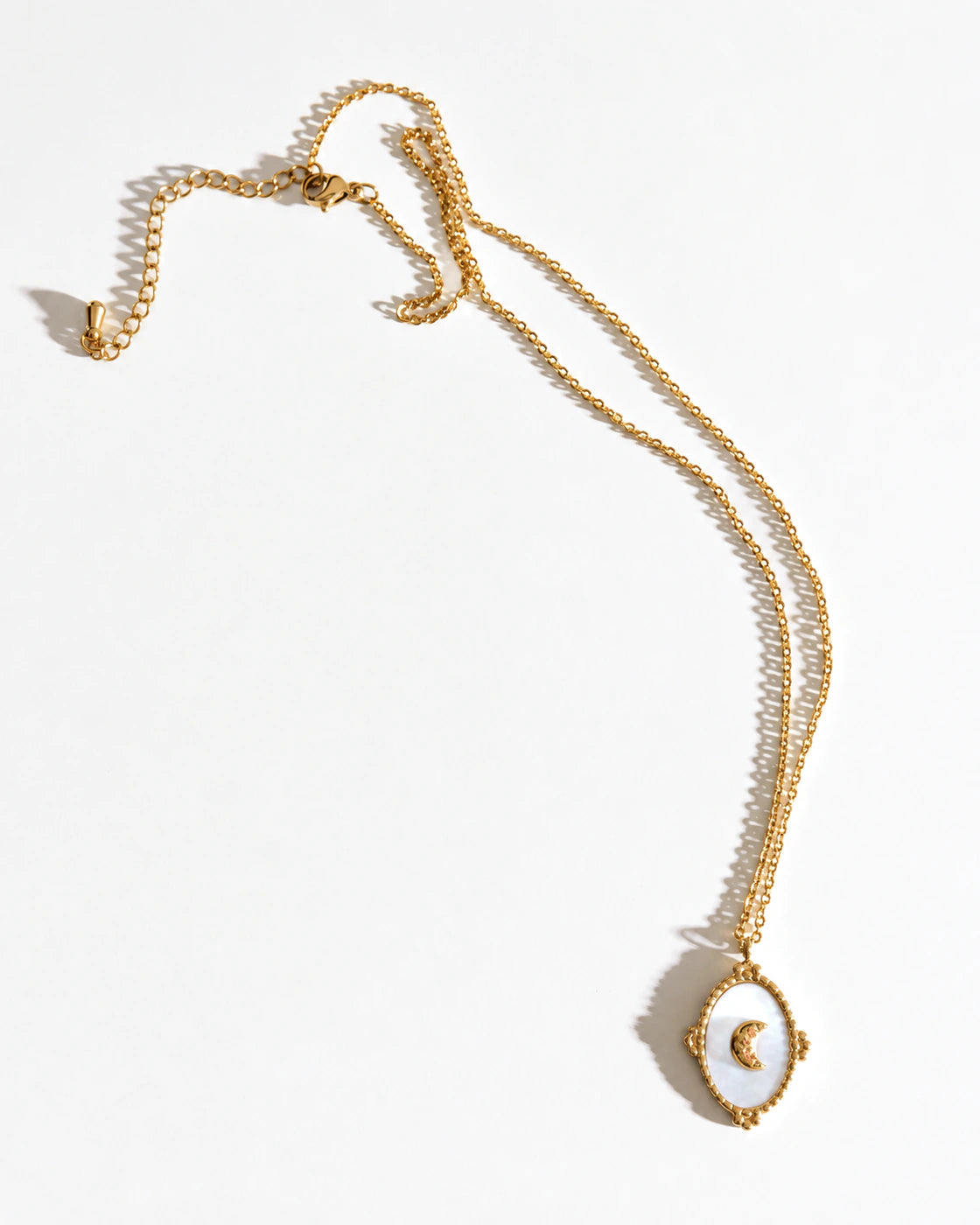Full-length view of the Tide Stone Pendant Necklace laid flat