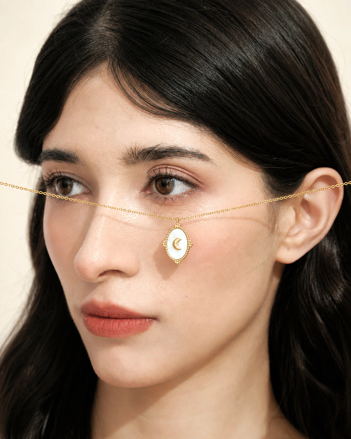Model wearing the Tide Stone Pendant Necklace with a matching ring