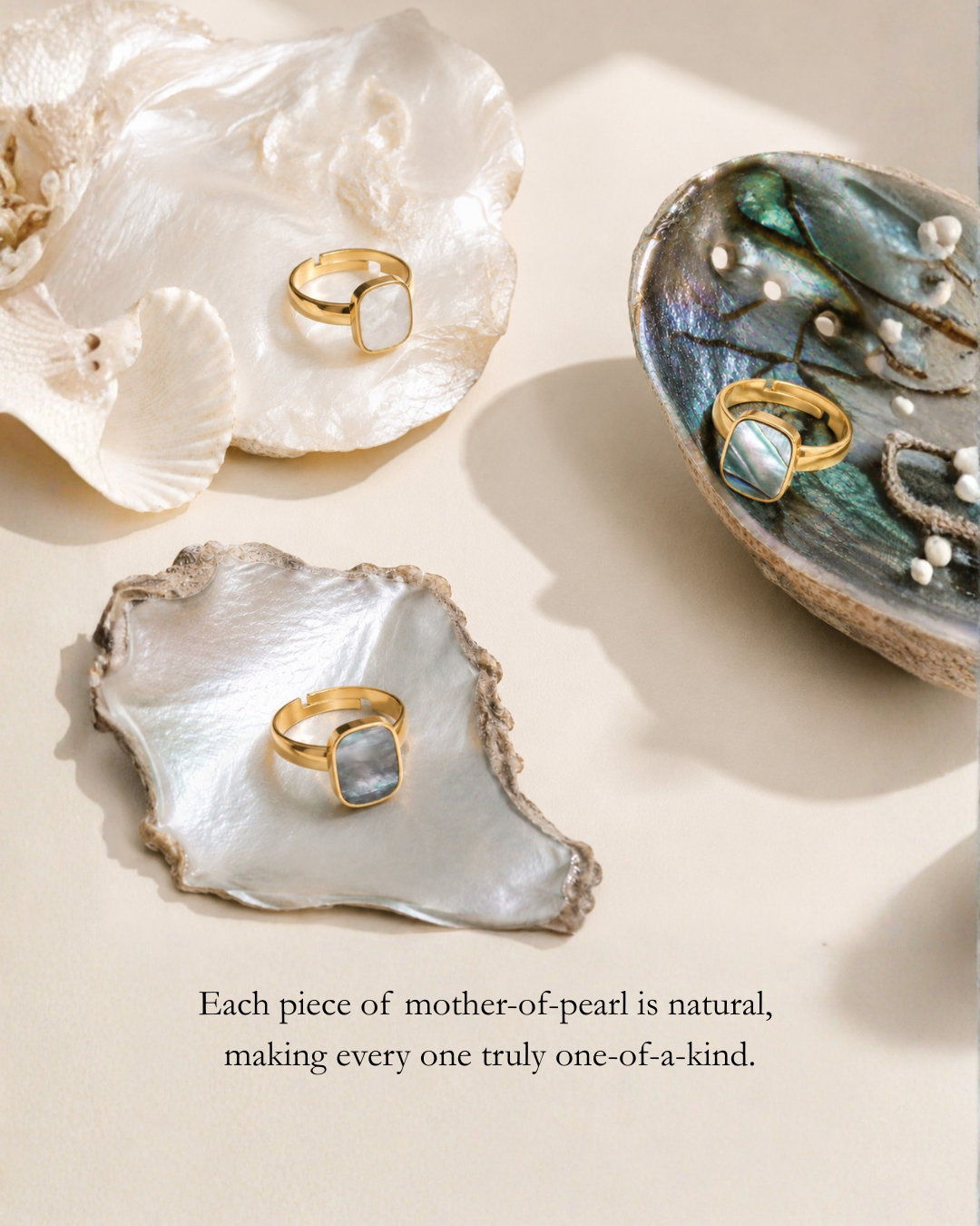 Two gold rings displayed on mother-of-pearl shells with natural variation note
