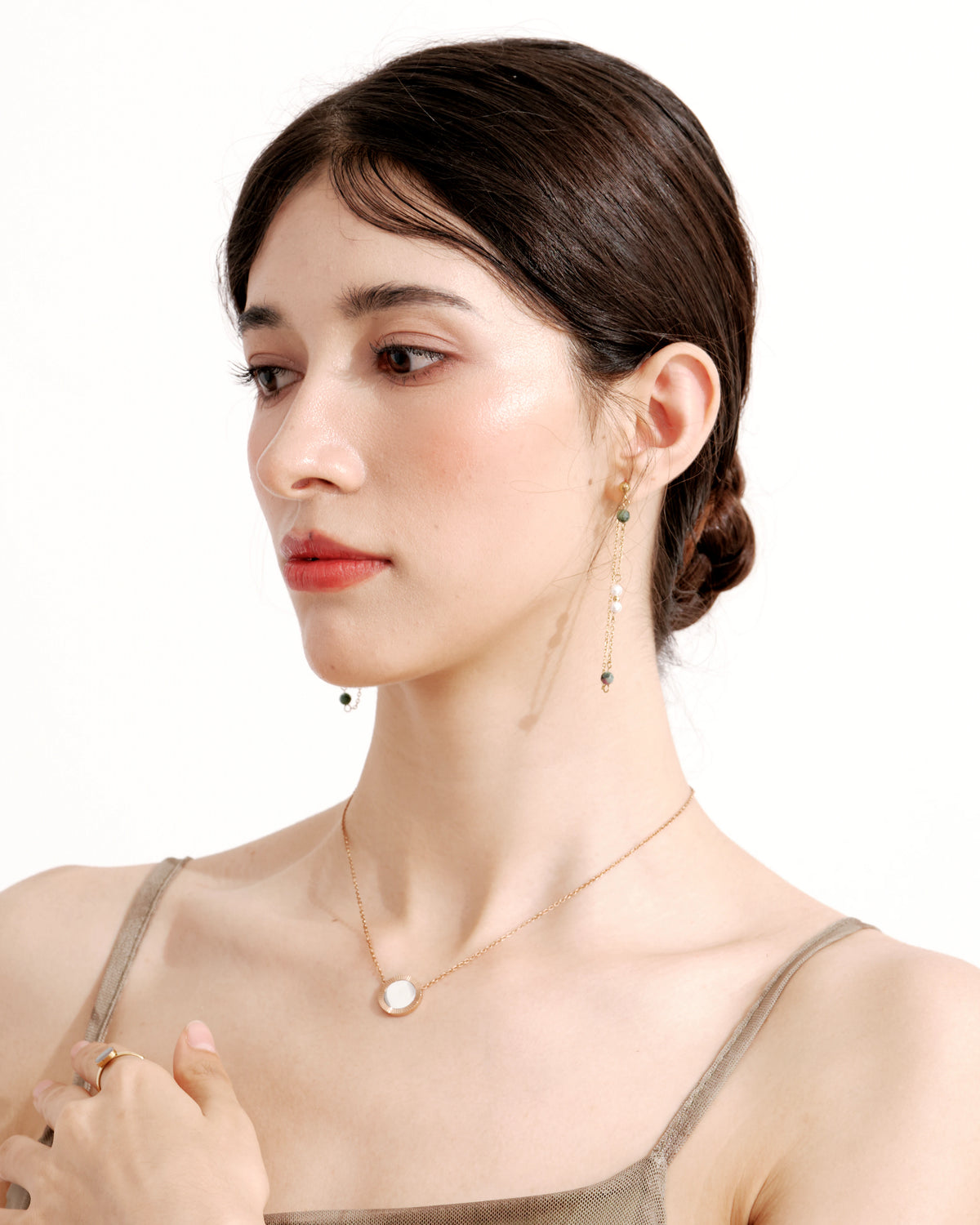 Model wearing the Rose Reflection Pendant Necklace with a white camisole