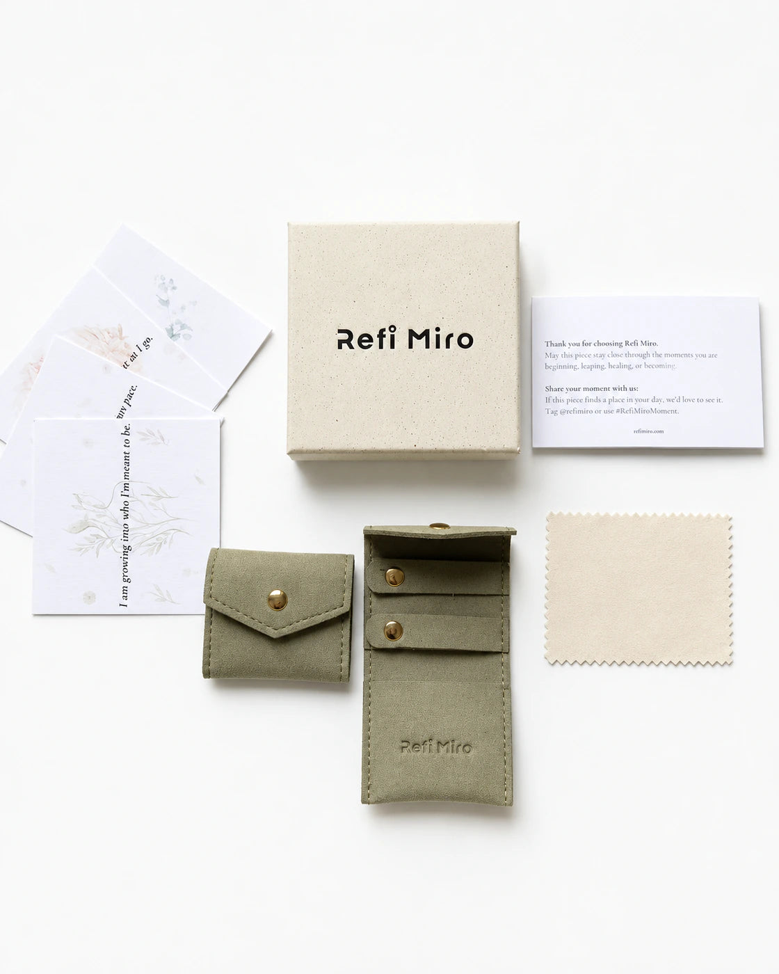 Refi Miro jewelry box, storage pouches, care cards, and polishing cloth