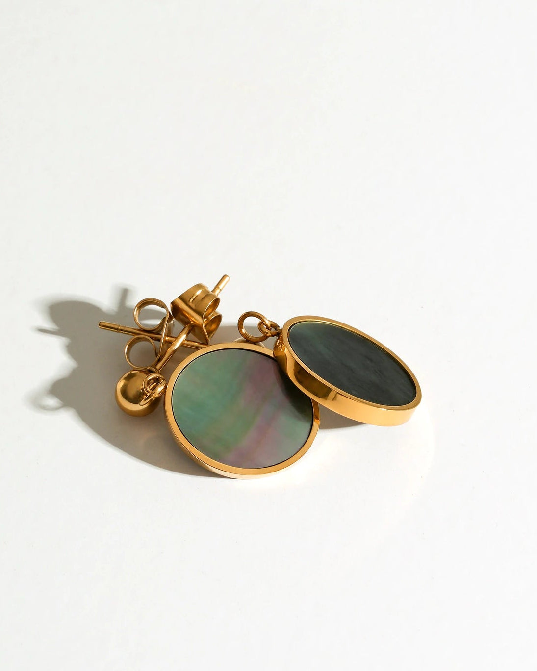 Front and back views of the Mist Tide Stud Earrings