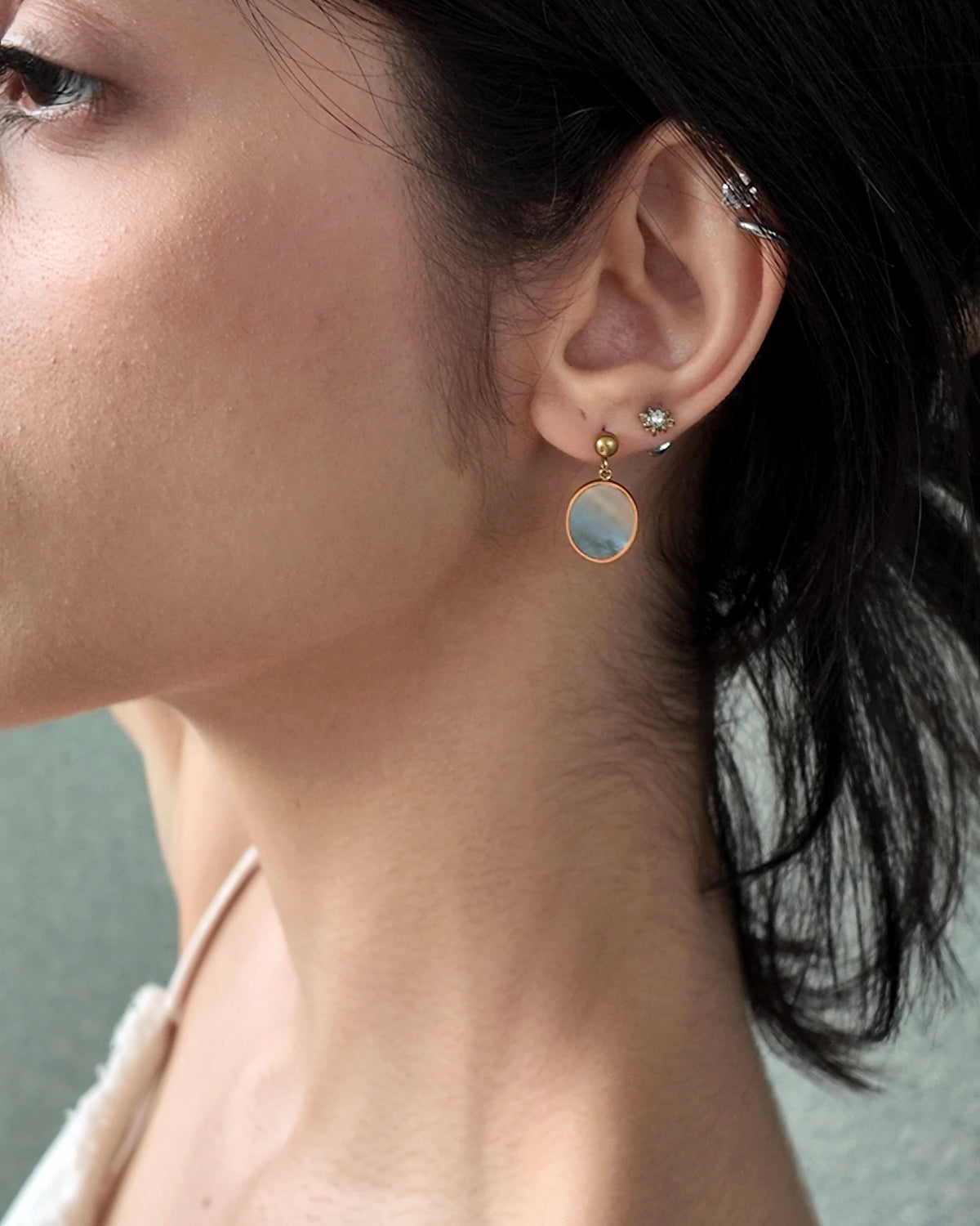 Side view of model wearing the Mist Tide Stud Earrings